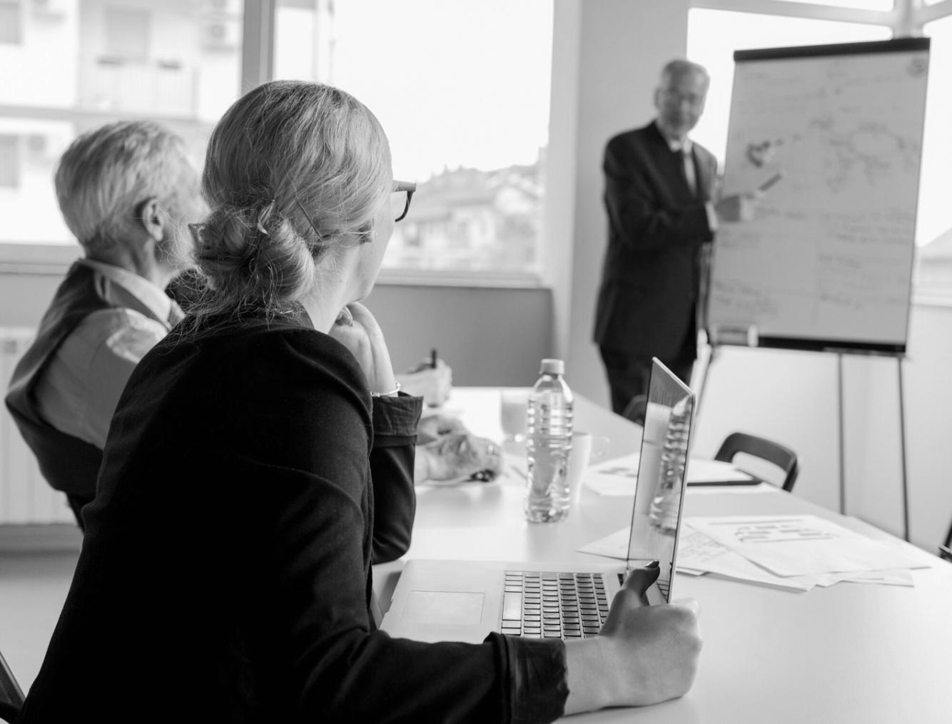 Journalists at work in a modern newsroom environment